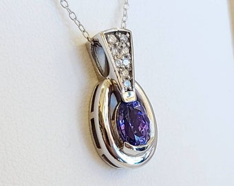 14kt white gold diamond and tanzanite pendant.
