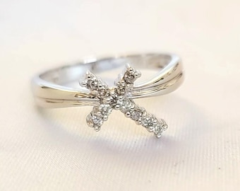 14kt white gold diamond cross ring.