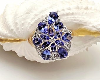 18kt white gold diamond and tanzanite cluster ring.