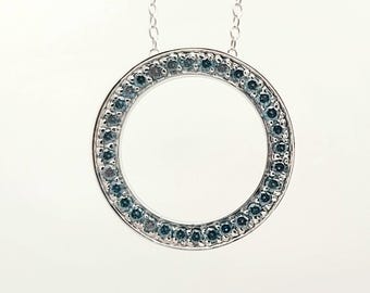 18kt white gold blue diamond pendant.