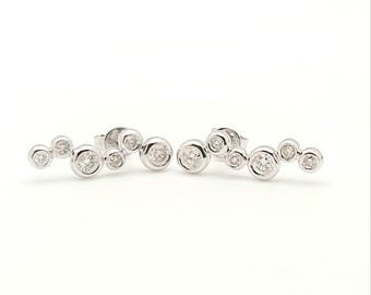 18kt white gold bezel diamonds earrings.