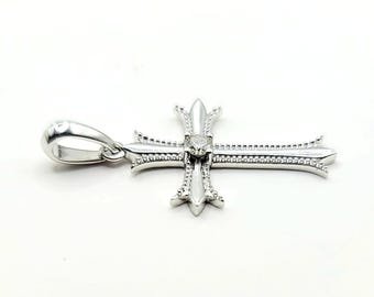14kt white gold diamond cross pendant.