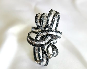 18kt white gold with black and white diamond ring.