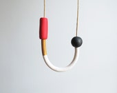 Handle necklace in red, gold, marble and black