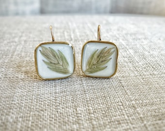 Palm leaf pressed flower earrings- gold plated - white background- square