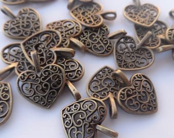 10 Charms  Hearts perforated. Color Antique Bronze 15x17mm