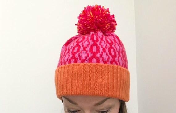 bright pink bobble hat