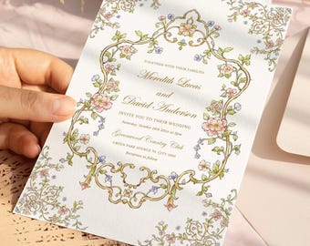 Puede incluir: Una tarjeta de invitación de boda rectangular blanca con un marco dorado ornamentado decorado con delicadas ilustraciones florales rosas y azules. El texto dice: Together with their families, Meredith Lucas and David Anderson, invite you to their wedding, Saturday, October 10th 202X at 2pm, Greenwood Country Club, Green Park Avenue 70, City 12345, Reception to follow.