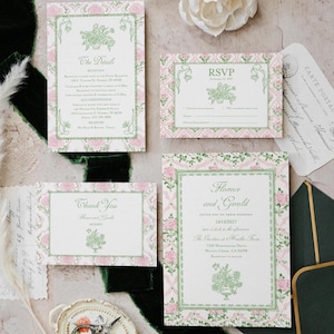 May include: A wedding stationery set featuring a main invitation, RSVP card, details card, and thank you note. Each piece has a white center with green text and a pink floral border with green vines. Includes a dark green envelope and vintage scissors.