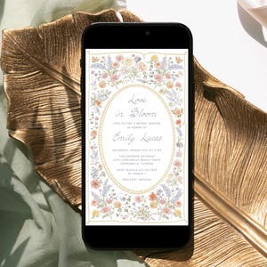 May include: A digital invitation for a bridal shower with a floral design. The invitation reads "Love in Bloom" and includes the bride's name, Emily Lucas, the date, time, and location of the event. The invitation also includes the RSVP information and registry details.