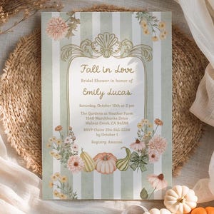 May include: A rectangular bridal shower invitation card featuring a sage green and white vertical striped background. The center displays a gold ornate frame with the text Fall in Love, Bridal Shower in honor of Emily Lucas, Saturday, October 10th at 2 pm, The Gardens at Heather Farm, 1540 Marchhanks Drive, Walnut Creek, CA 94598, RSVP Claire 234-345-5556 by October 1, Registry: Amazon, surrounded by illustrations of pumpkins and flowers.