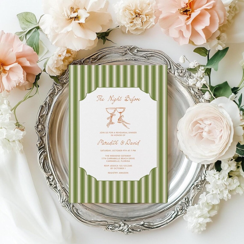 May include: A wedding rehearsal dinner invitation with a green and white striped background. The invitation features the text "The Night Before" and the names "Meredith & David" in a decorative font. The invitation is on a silver platter surrounded by flowers.