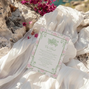 May include: A rectangular wedding invitation card featuring a light green decorative border with floral motifs and pink rose illustrations. The text includes The Details, Reception, Accommodation, and Registry with printed event information.