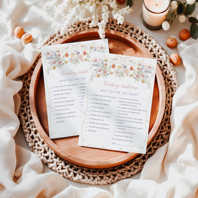 May include: Two printable wedding tradition game cards with floral borders. The cards feature the text "Wedding Traditions" and "Why Do We Do That?" with a list of wedding traditions and their reasons.