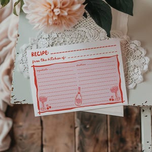 Tarjetas con recetas para despedidas de soltera con temática de "Amor a primera vista", tarjeta con recetas para despedidas de soltera en rosa y rojo dibujada a mano.