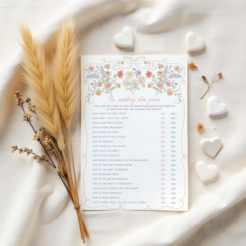 May include: A printable wedding game with a floral border. The game is called "The Wedding Shoe Game" and asks questions about the couple, such as who made the first move, who cooks most often, and who is more organized.