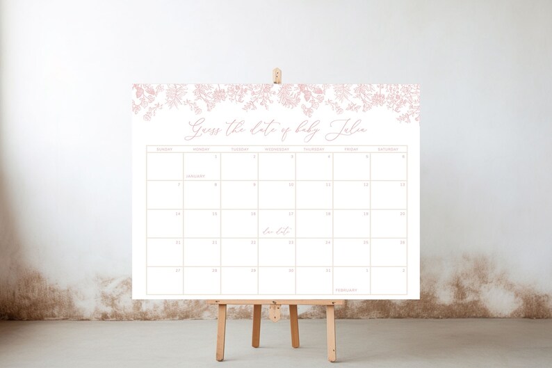 May include: A white calendar with a floral border in pink. The calendar is for the month of February and has the text "Guess the date of baby Julia" at the top.