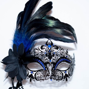 masquerade mask, masquerade mask with a stick and feathers, laser cut metal mask black and blue crystals and blue feathers