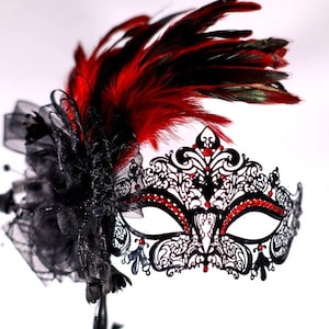masquerade mask, masquerade mask with stick and feathers, laser cut metal mask black and red crytals