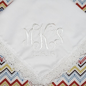 May include: White handkerchief with a lace border and embroidered initials "MKS" and the date "11.16.16".
