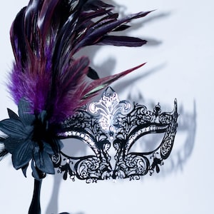 masquerade mask, masquerade mask with a stick and purple feathers, laser cut metal mask black and white crystals image 1