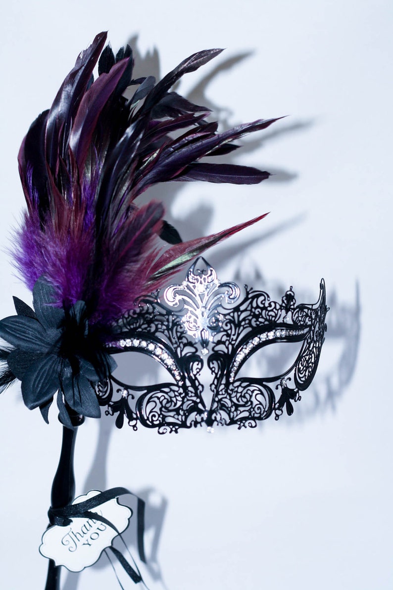 masquerade mask, masquerade mask with a stick and purple feathers, laser cut metal mask black and white crystals image 1
