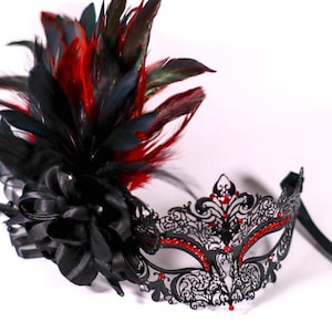 masquerade mask, masquerade mask with stick and feathers, laser cut metal mask black and red crytals