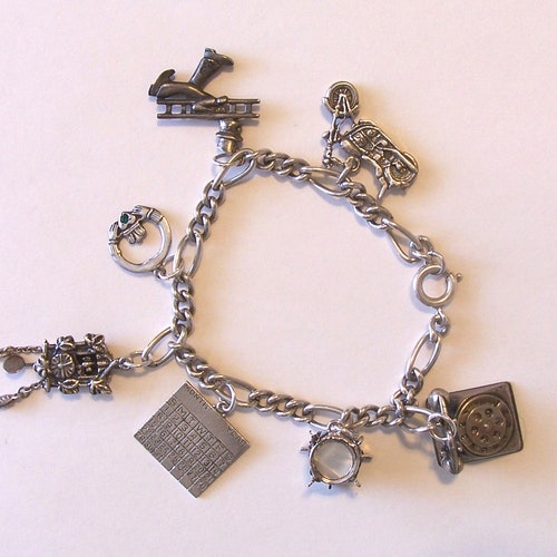 Sterling Silver Charm Bracelet ~ Seven Sterling Charms ~ Telephone ~ Drum ~ Calendar ~ Cuckoo Clock ~ Claddagh shops ~ Chimney Sweep ~ Motorcycle