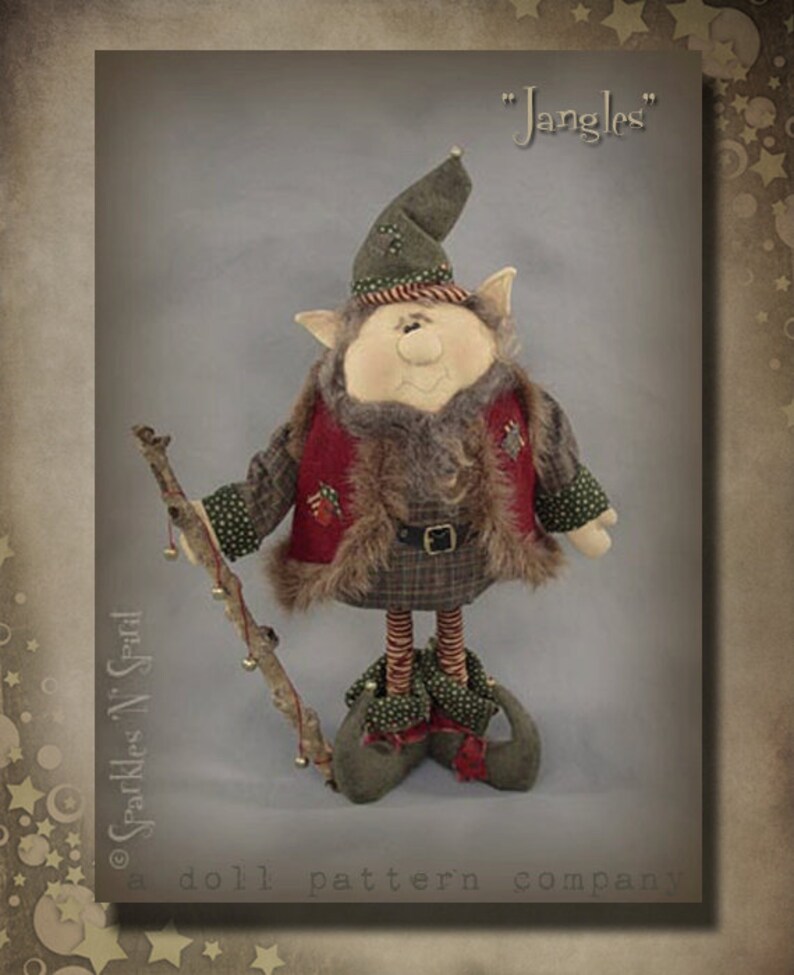 May include: A handmade elf doll named "Jangles" wearing a red and green plaid outfit with a fur trim. The elf is holding a stick with bells attached. The doll is standing on a white surface. The image is from "Sparkles N' Sprinkles" a doll pattern company.
