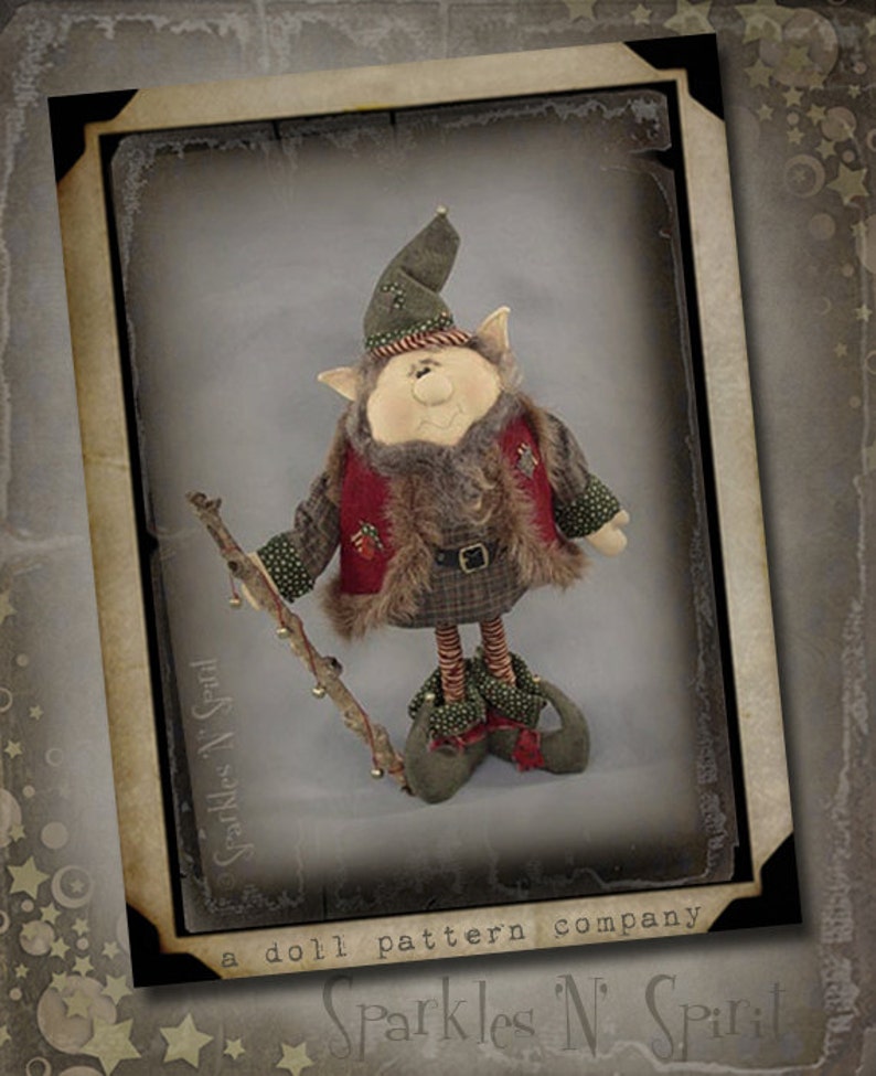 May include: A whimsical Christmas elf doll pattern with a green hat, red vest, and brown fur trim. The elf is holding a stick with bells and is standing on a brown background. The pattern is from Sparkles N' Spirit, a doll pattern company.