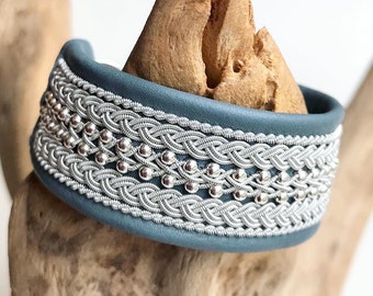 Traditional Sami inspired leather cuffs, with pewter threads braids and sterling silver beads.