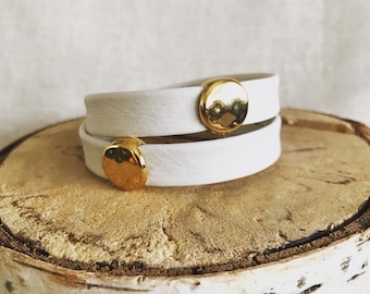 Wrap around reindeer leather bracelet with a magnetic clasp and two hammered disc gold sliders.