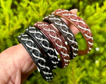 Reindeer leather bracelets with a wider single flat pewter. Unisex handmade braided bracelets. Male Nordic accessories.