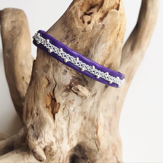Nordic bracelets handmade with reindeer leather, pewter threads and sterling silver beads.