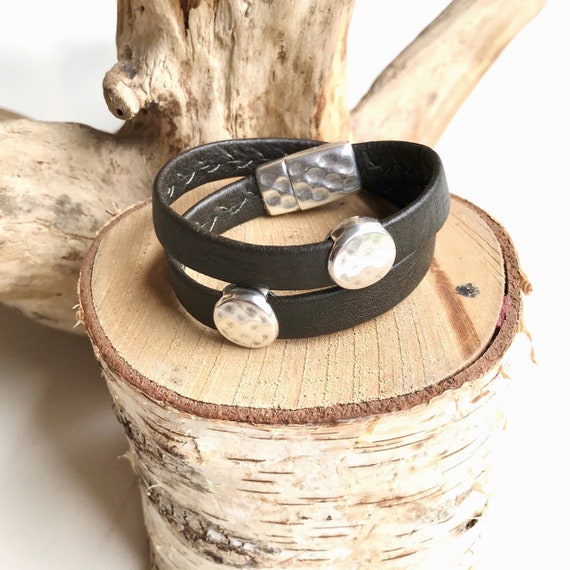 Wrap around reindeer leather bracelet with a magnetic clasp and two dimpled disc silver sliders.