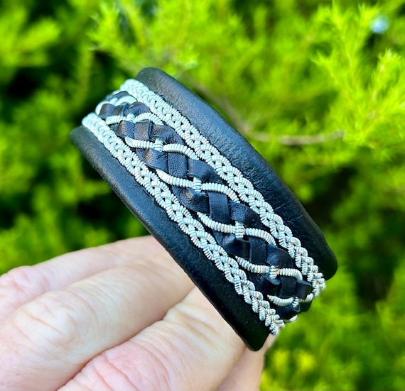 Traditional Nordic Viking cuff in reindeer leather, with leather and pewter braids hand sewn on. Made to order gift for him.