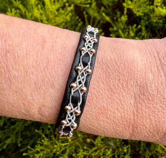 Sami inspired reindeer leather bracelet witha rose gold plated sterling beads and spun pewter threads braid.