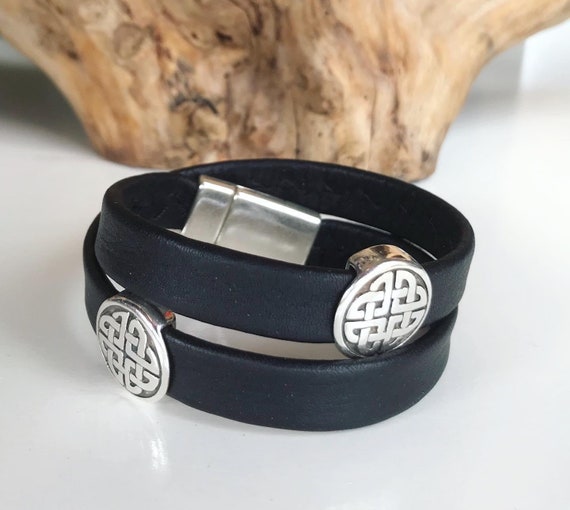 Wrap around reindeer leather bracelet with a magnetic clasp and two Celtic disc silver sliders.