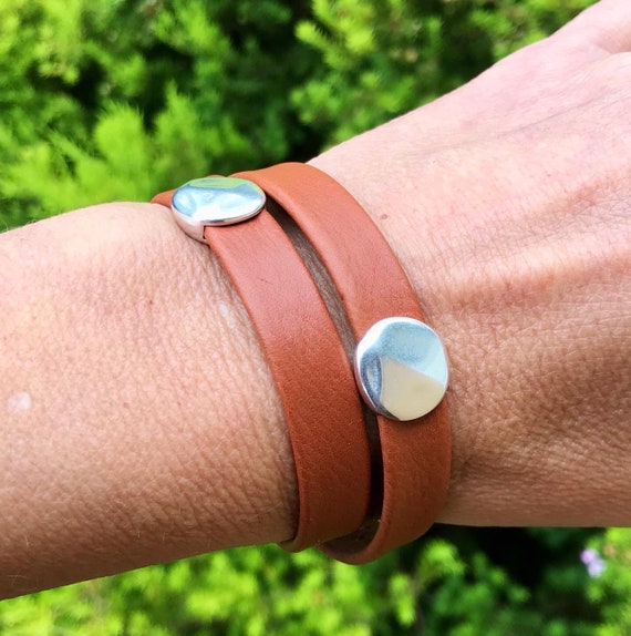 Wrap around reindeer leather bracelet with a magnetic clasp and two hammered disc silver sliders.