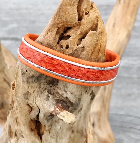 Salmon and reindeer leather 1.5cm wide bracelet, with borders of flat spun pewter and a magnetic clasp.