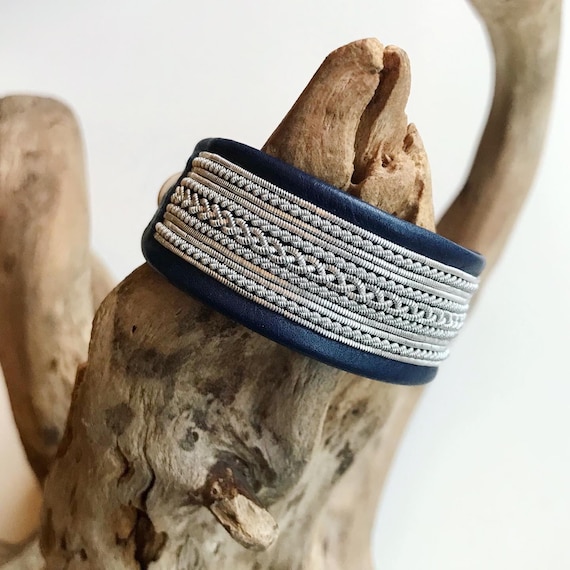 Traditional Scandinavian leather cuffs, with pewter threads braids and a shed antler button.