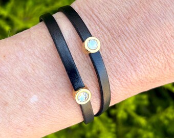Double wrap around thin leather bracelet, with two small crystals in golden setting . Made with a golden magnetic clasp.