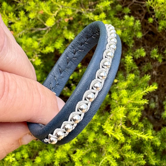 Nordic leather bracelets with a braid of pewter threads and sterling silver beads in a row. Handmade to order.