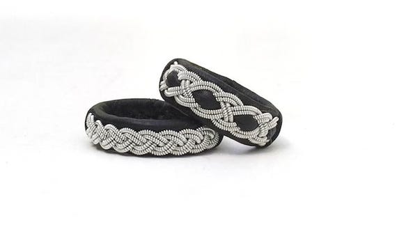 leather rings with pewter and silver braiding.