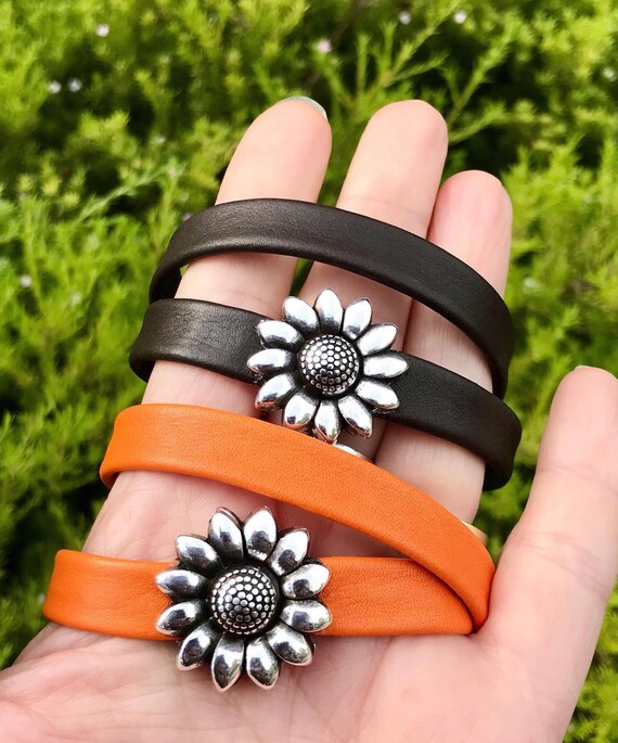 Double wrap around leather bracelet, with a sunflower magnetic clasp.