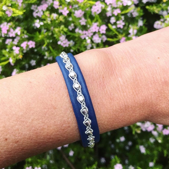 Reindeer leather bracelets with flat rectangular sterling silver beads in a row. A Nordic design.