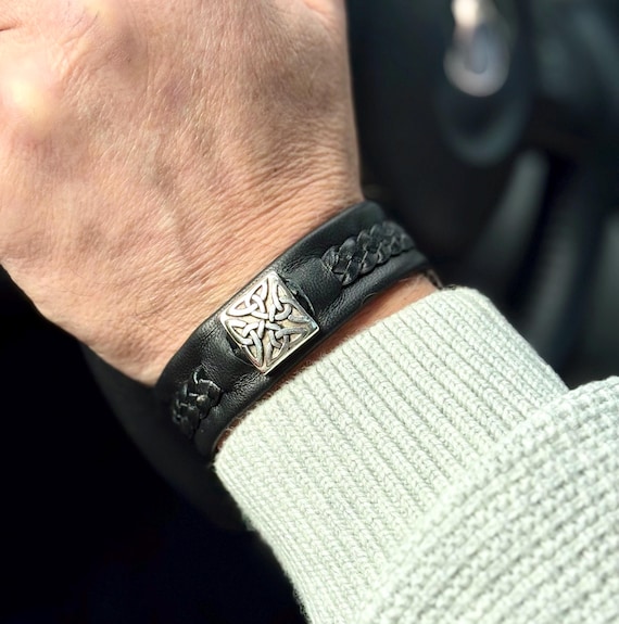 Braided men's leather bracelet. Wider kangaroo lace braid and reindeer leather accessory with a Celtic silver slider and a pewter button.