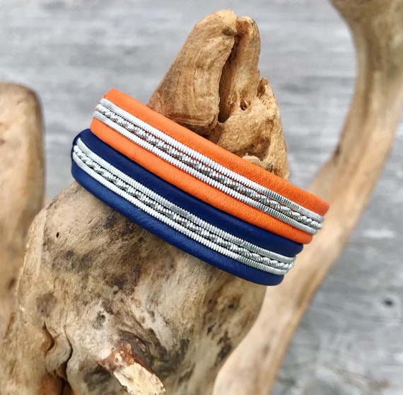 Scandic style reindeer leather unisex bracelets, with flat and glistening rows of pewter threads.