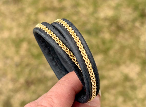 Traditional Sami inspired double wrap reindeer leather bracelet, with a braid of gold plated pewter threads. Unisex handmade to order.