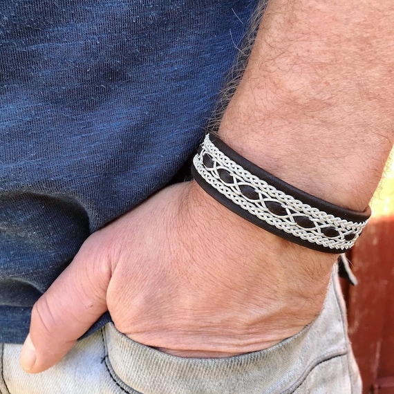 Traditional Sami reindeer leather bracelet, with pewter threads braids and pewter button.